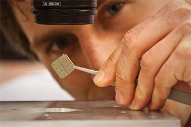 Stefan Kowalczyk holding a nanopore chip
