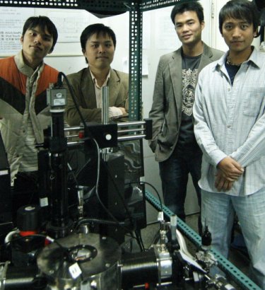 Research team in front of the probe station