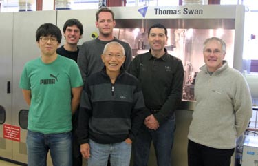Researchers in front of the MOVPE setup