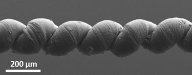 Wax-filled nanotube yarn