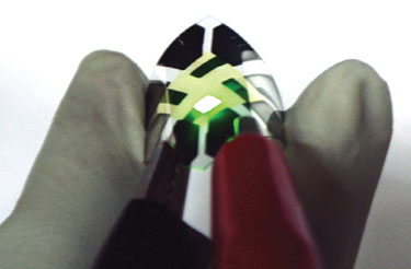 A fluorescent green graphene-anode OLED