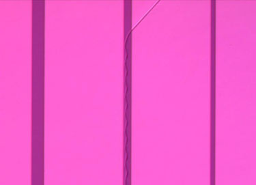 Microscope image showing cracks in a substrate/thin-film composite