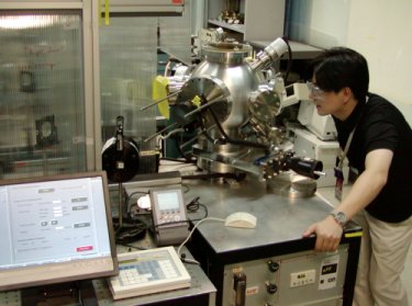 Sung-Hun Wee alongside the pulsed laser deposition apparatus