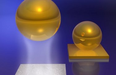 Casimir-Lifshitz force between a gold-coated ball and a silica plate in a fluid