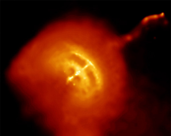 An image of the Vela pulsar (which lies at the heart of the Vela supernova remnant) in which glitching has been observed. The pulsar itself is the bright white spot at the centre of the hot gas, and a jet powered by its rotational pole is also observed in this Chandra X-ray Observatory image. (Courtesy: NASA/CXC/PSU/G Pavlov <i>et al.</i>)