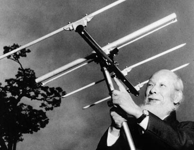 Hidetsugu Yagi holding his famous Yagi-Uda design of radio antenna