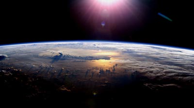 Photo of the Sun setting over the Pacific Ocean