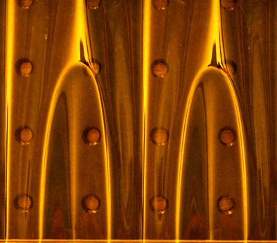Image of wrinklons in a plastic sheet