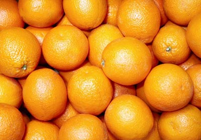 Photograph of stacked oranges