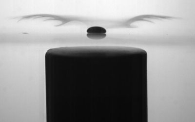 Image of a liquid-oxygen Leidenfrost drop, levitating over a glass plate, with a magnet underneath