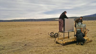 Researchers installing a detector
